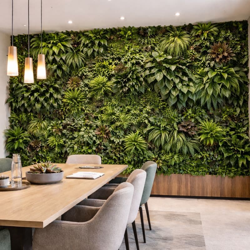 large-indoor-green-wall-feature-in hotel-reception-area