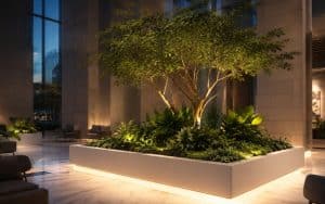 Integrated indoor outdoor greenery design connecting a courtyard and lobby as one planned system