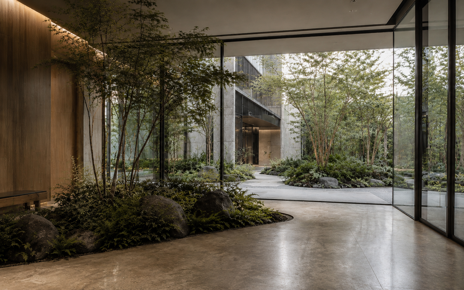 Integrated indoor outdoor greenery design connecting a courtyard and lobby as one planned system